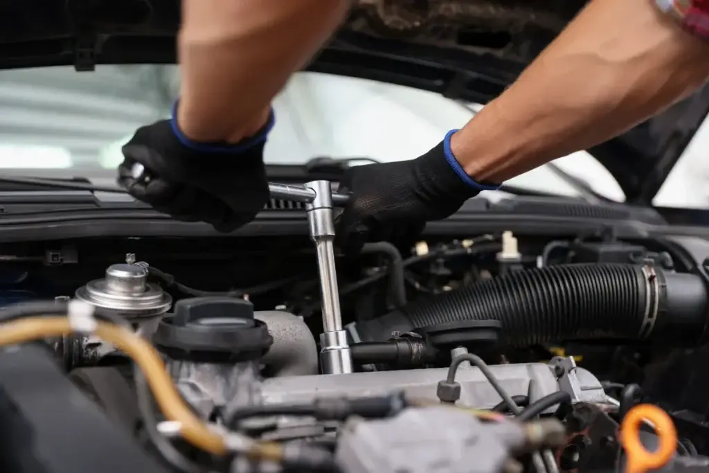 Mechanic working under the bonnet